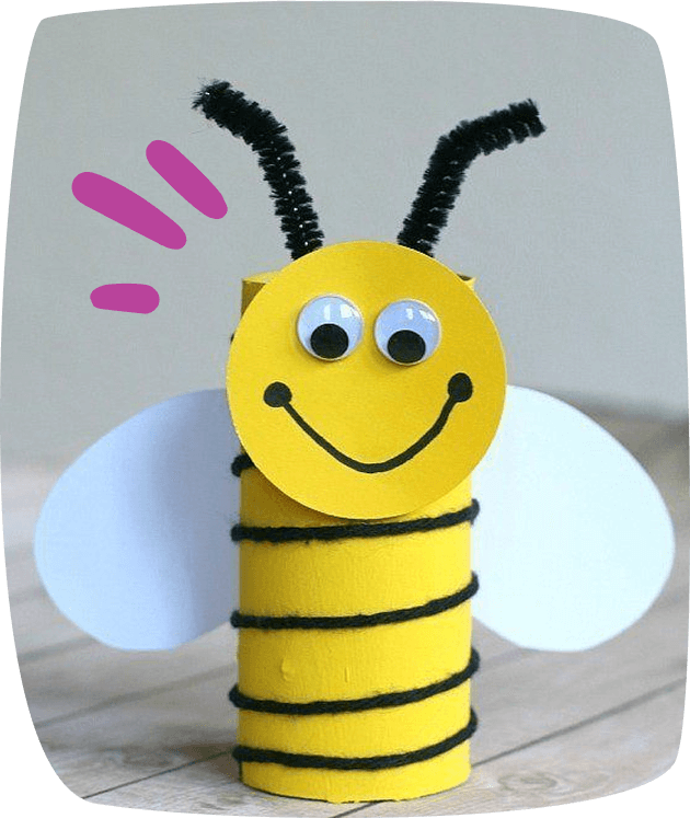A handmade bumble bee craft made from a yellow painted toilet paper roll, black yarn stripes, googly eyes, pipe cleaner antennae, and paper wings.